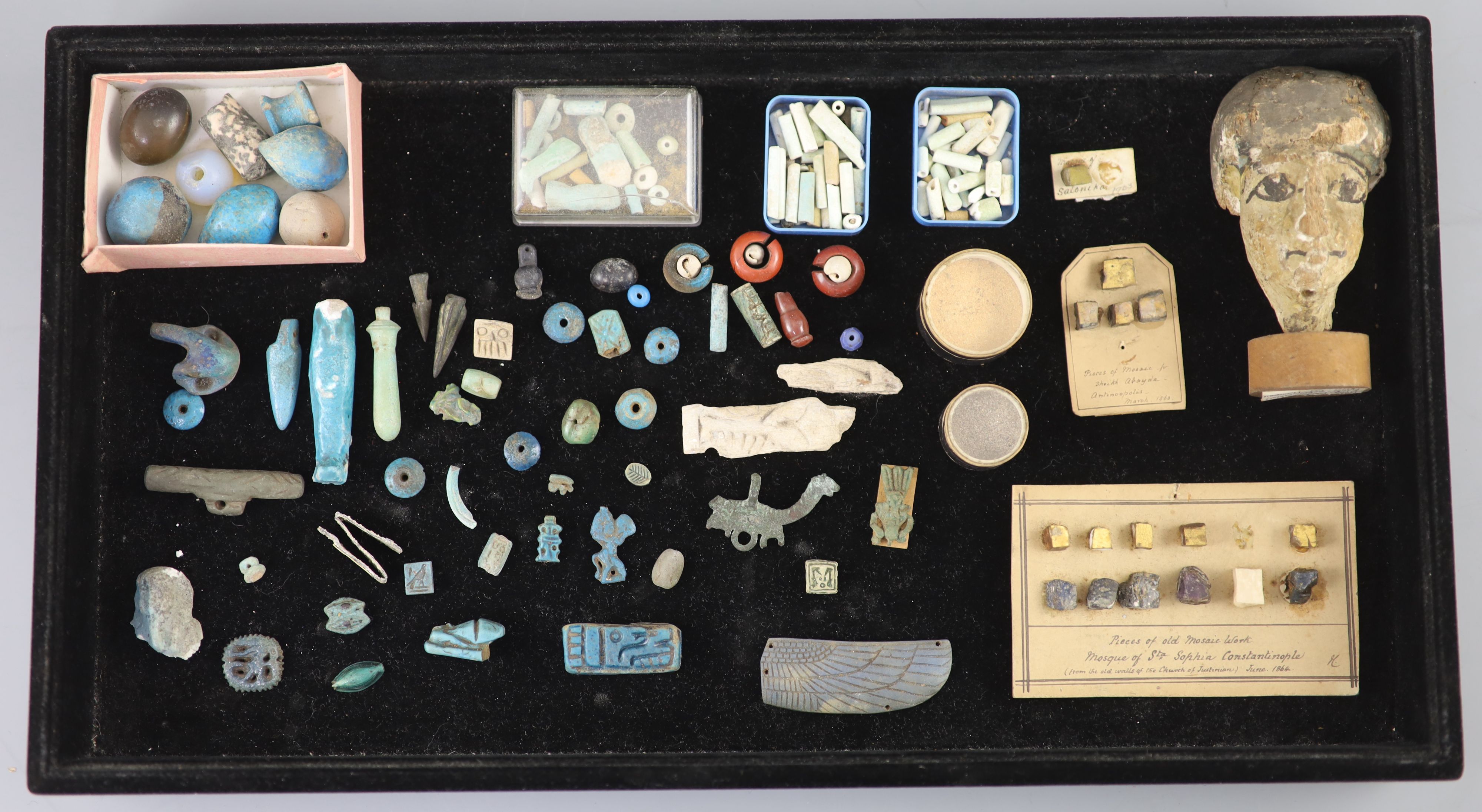 A group of Egyptian stone and turquoise glazed faience amulets, beads and fragments, late Kingdom to Roman period, Provenance - A. T. A